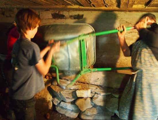  Village life Romania. Storing potatoes under the house for fierce Romanian winters.