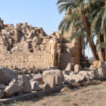 Man walking in the Egyptian ruins in Luxor
