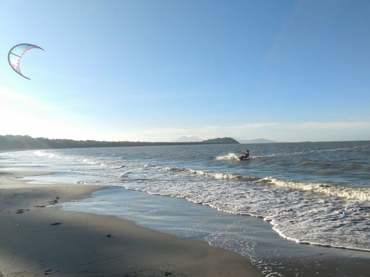 kite surfer on beach Is travel self indulgent kite surfing