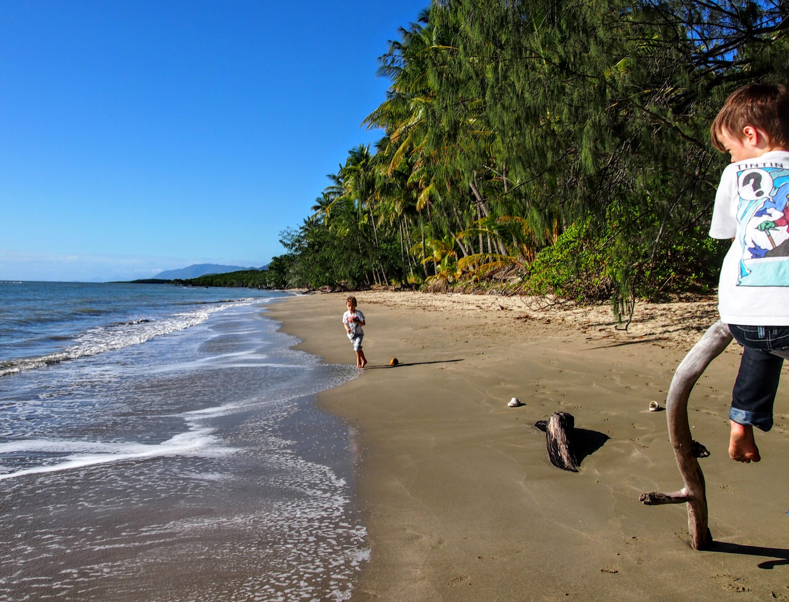 kids on an unspoilt beach port douglas australia