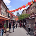 Chinatown Singapore - What To See Street scene with shops and lanterns in Chinatown Singapore