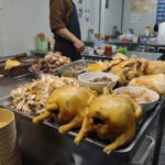 Hanoi, Michelin Guide Food Tour Michelin Guide street food Hanoi, braised chickens on the street.