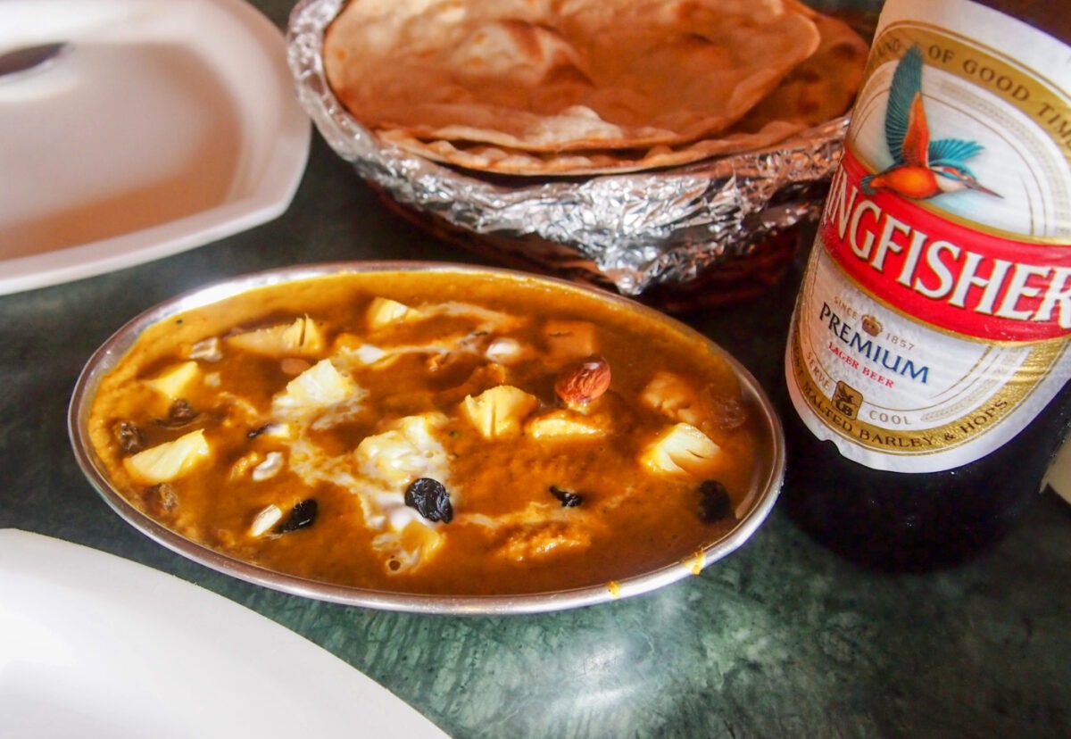 Photo of Goad curry and beer Kingfisher. It is worth visiting Goa for the food!
